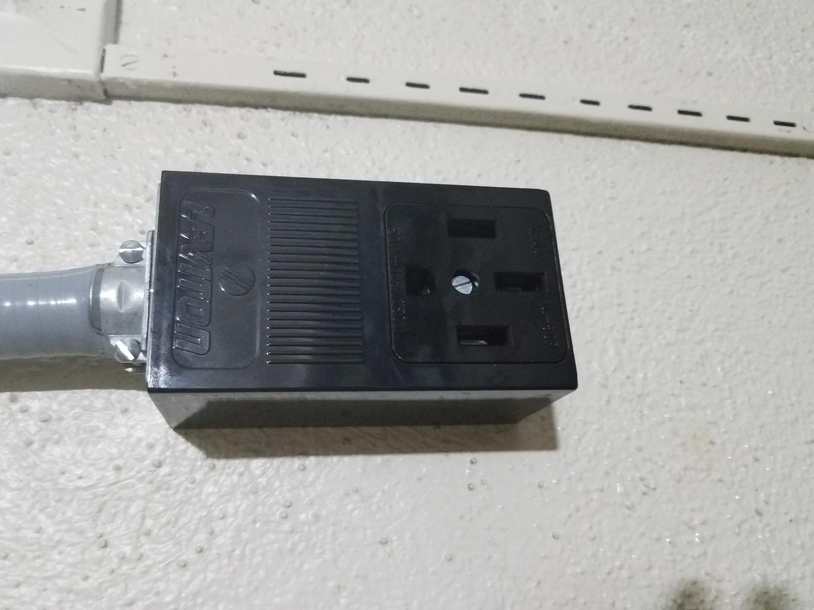 Leviton 55050 50 Amp, 125/250 Volt, NEMA 14-50R, 3P, 4W, Surface Mounting Receptacle, Straight Blade, Industrial Grade, Grounding, Side Wired, Steel Strap, 1 Pack, Black customer photo 1