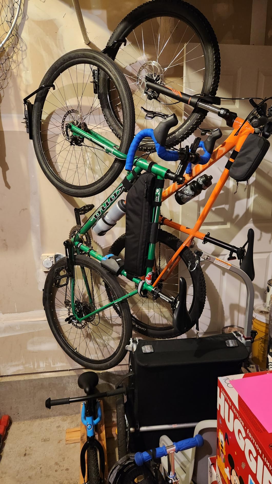 StoreYourBoard Bike Hangers for Garage | Garage Bike Rack Wall Mount, Vertical Bicycle Rack for Garage | 124 Degree Swivel Bike Wall Mount with Stopper, Holds 50lbs, Fits All Wheel Diameters, Max 2.6