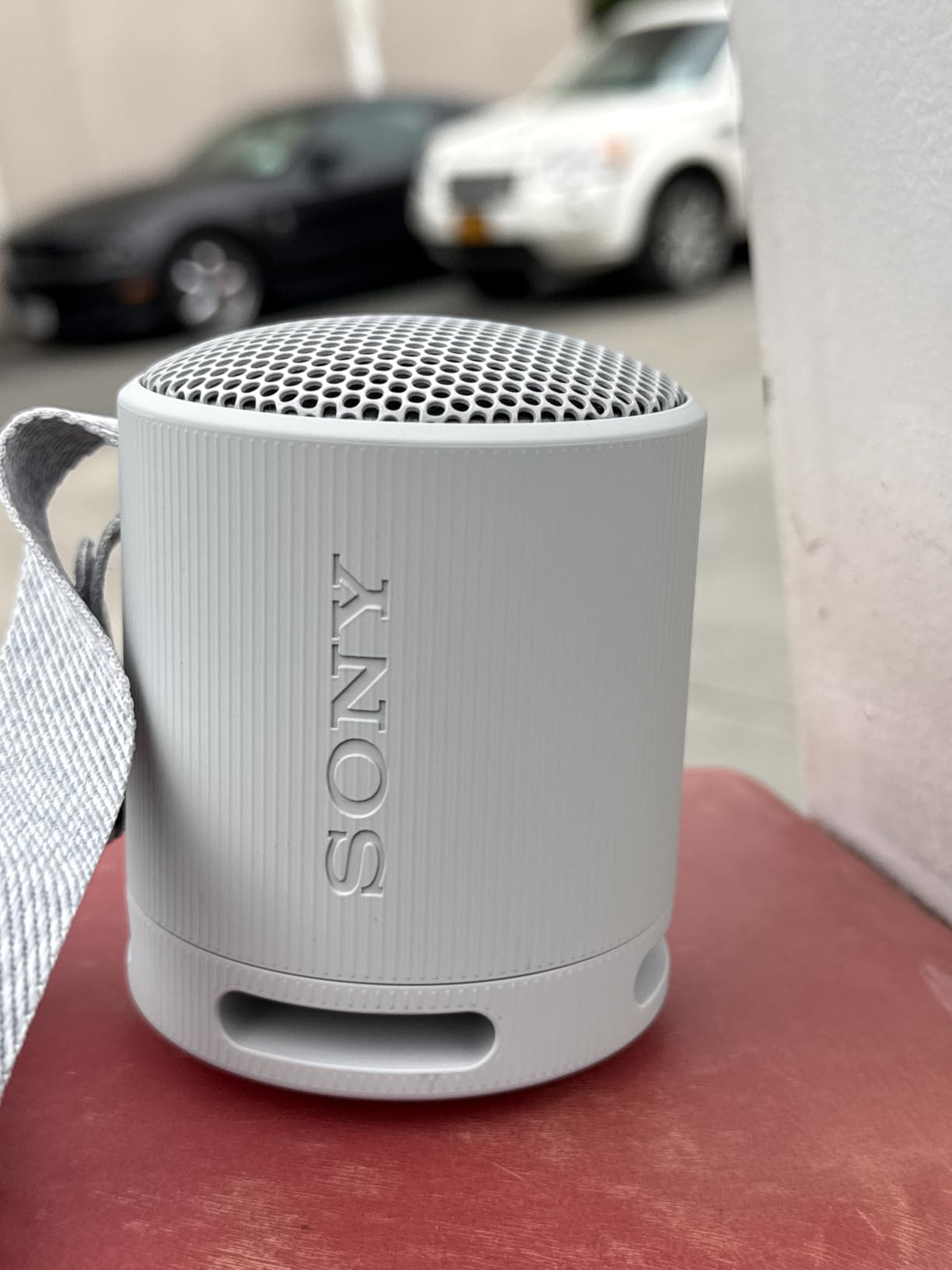 Sony SRS-XB100 Wireless Bluetooth Portable Lightweight Super-Compact Travel Speaker, Durable IP67 Waterproof & Dustproof Shower Speaker, 16 Hour Battery, Versatile Strap, & Hands-free Calling, Orange customer photo 2