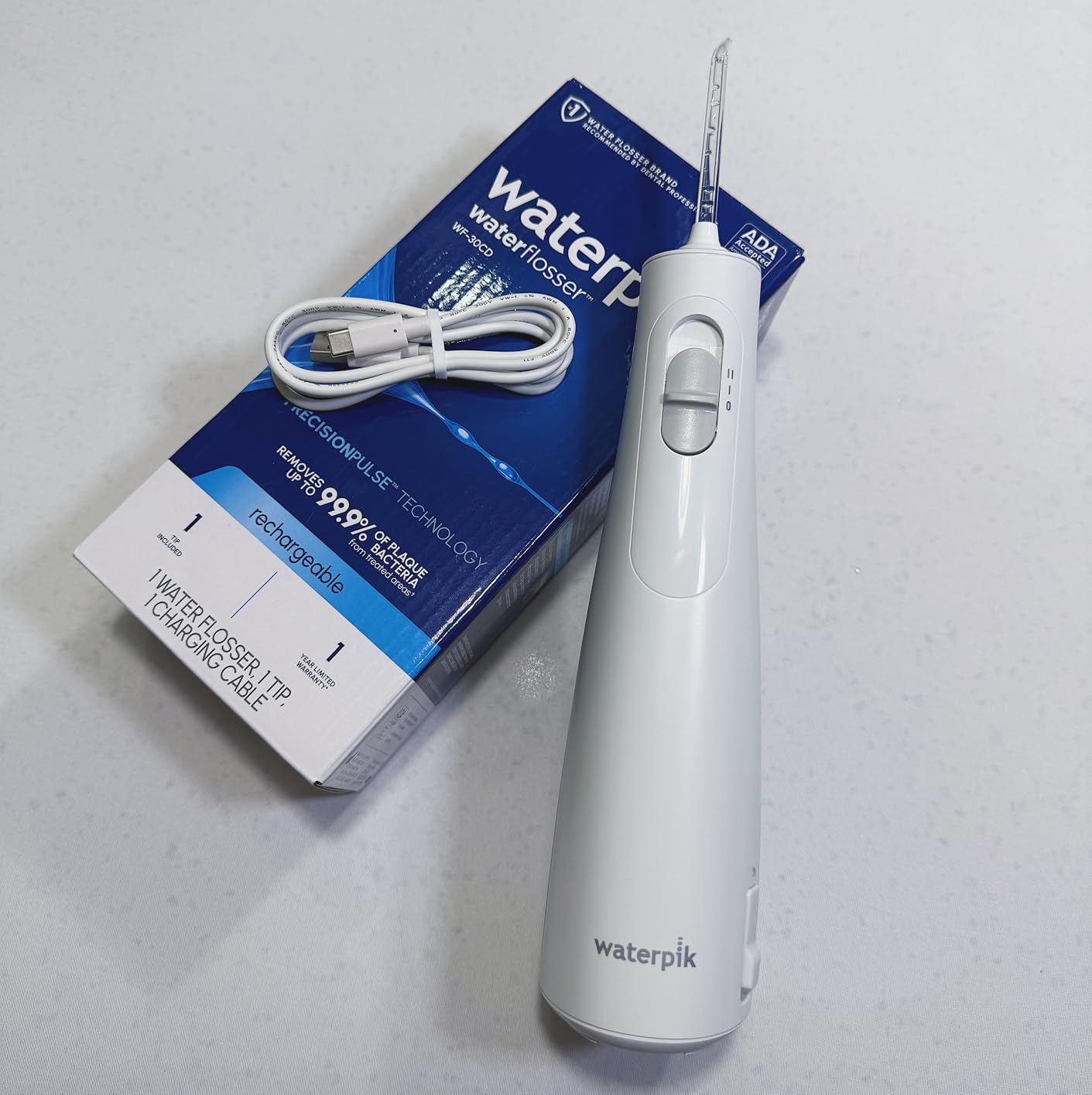 Waterpik Cordless 1100 Rechargeable Portable Water Flosser for Teeth Cleaning and Flossing, Travel, Braces Care, Healthier Gums, Waterproof for Shower, ADA Accepted, WF-30CD White, Packaging May Vary customer photo 1