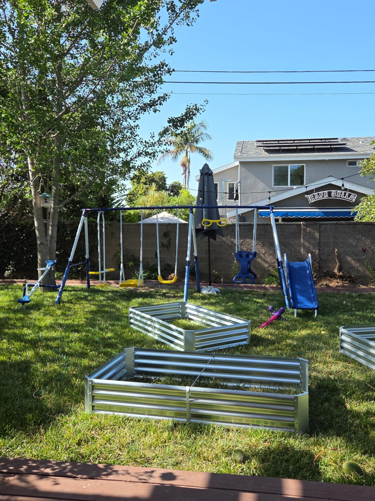 Sportspower Super 9 Metal Swing Set for Outdoor Backyard Play: Teeter Totter, Glide Ride, Roman Glider, Standing Swing, Trapeze, 5ft Slide, Anchor Kit, 7.5' D × 17.1' W × 6.1' H customer photo 1