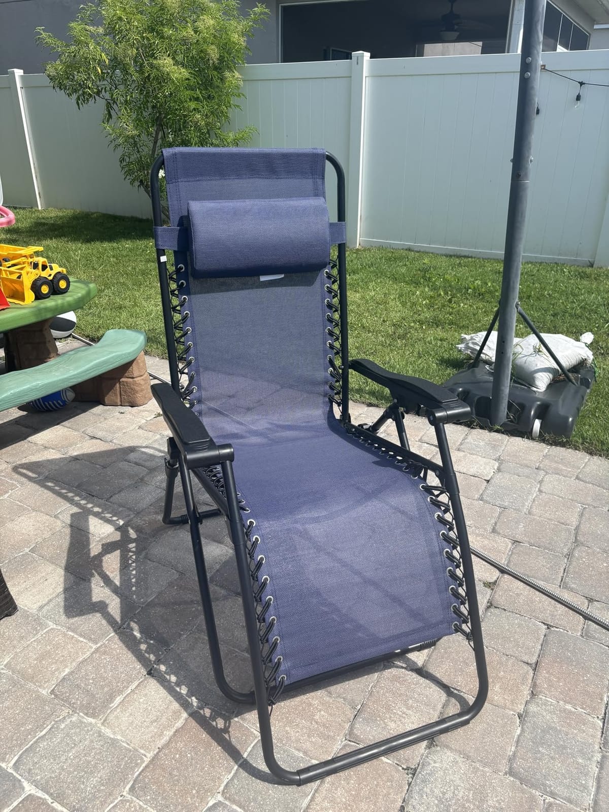 Amazon Basics Zero Gravity Lounge Chair with Pillow, Foldable Outdoor Reclining Chair for Patio and Beach, Weather-Resistant Textilene, 300 lb Capacity, 26 inch, Black customer photo 2