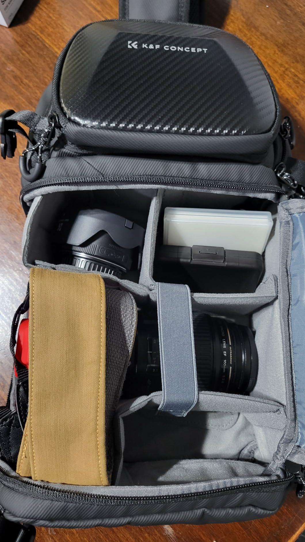 K&F CONCEPT Hardshell Camera Sling Bag, 10L EVA Case with Tripod Holder | EVA hardshell Camera Sling. Fits Mirrorless & Small DSLR. 5 Padded Dividers. Strap 33-43.7 in. Water & shock proof customer photo 1