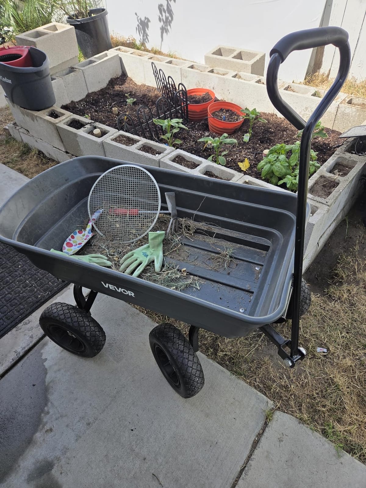 VEVOR Poly Garden Dump Cart 4 Cu.Ft. 600 lbs 4 Wheel Wheelbarrow Dump Wagon | For Orchard Farm, Adjustable Handle, Heavy Duty Yard Cart with 10 in All Terrain Wheels, Steel Frame & Quick Release System customer photo 2